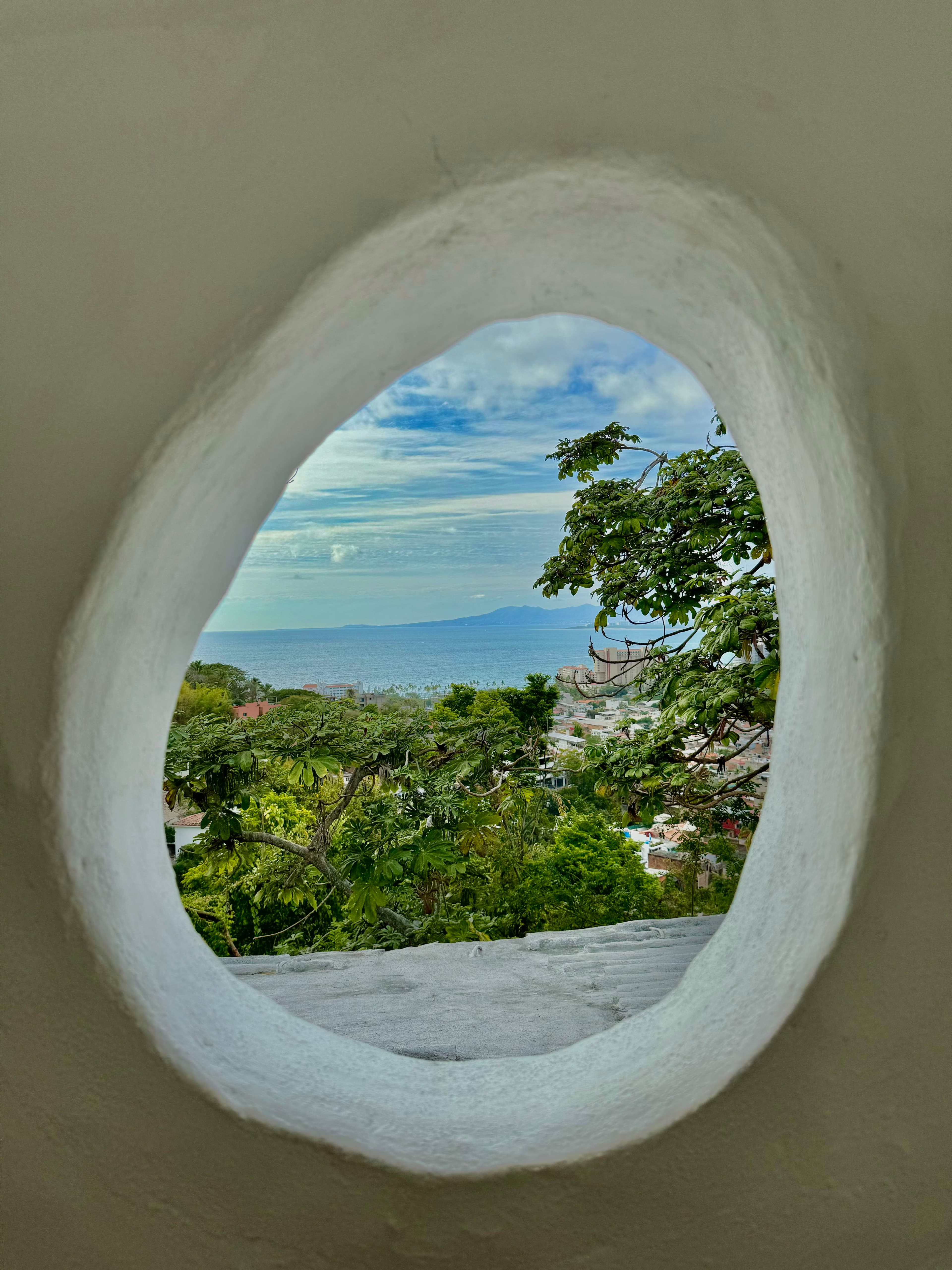Inspiration — coastal hills and sea through white stucco, Greece